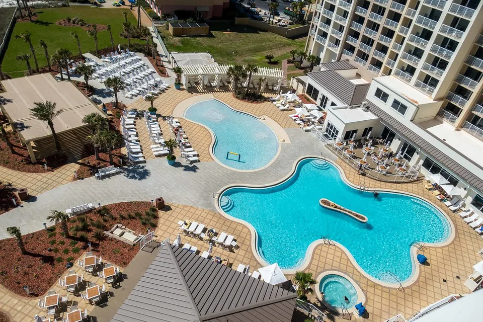 Pool complex and guest tower at Hilton Pensacola Beach, photographed in 2018.
