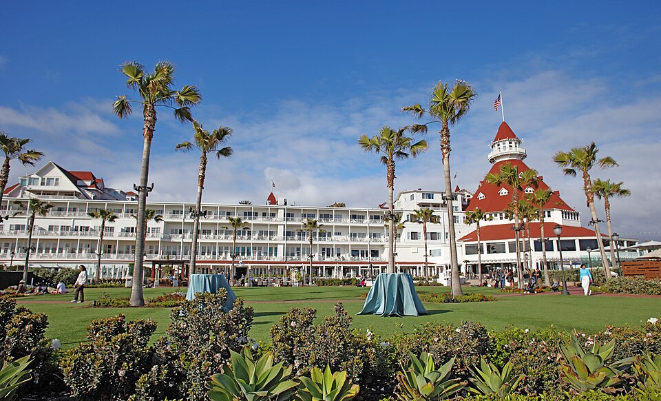 Beachside exterior and red-roofed turret of Hotel del Coronado, photographed in 2023.